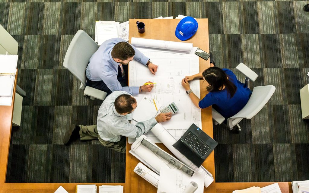 Professional property management company team reviewing community plans